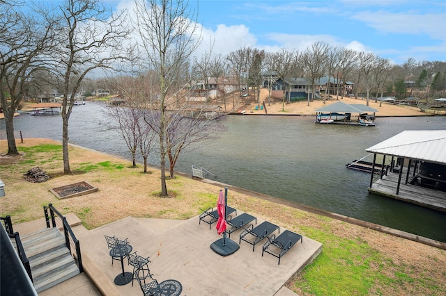 exterior space featuring a dock and a water view