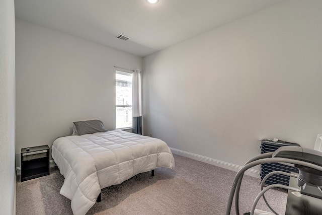 bedroom featuring carpet, visible vents, and baseboards