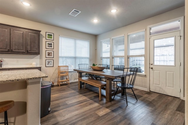 dining room featuring recessed lighting, dark wood-style flooring, visible vents, and baseboards