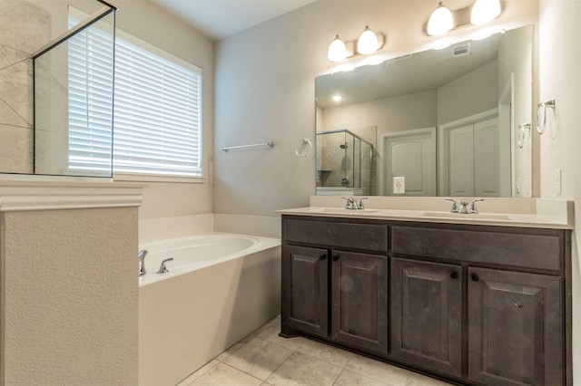 full bathroom featuring a garden tub, double vanity, a sink, and a shower stall