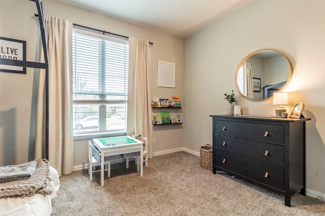 game room with light colored carpet and baseboards