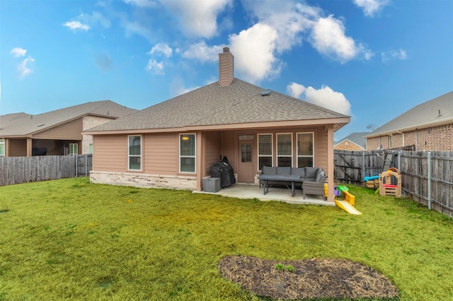 back of property featuring a lawn, a patio area, a fenced backyard, and an outdoor living space