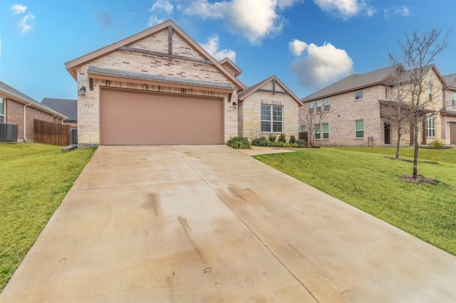 view of front of property featuring an attached garage, stone siding, concrete driveway, and a front yard