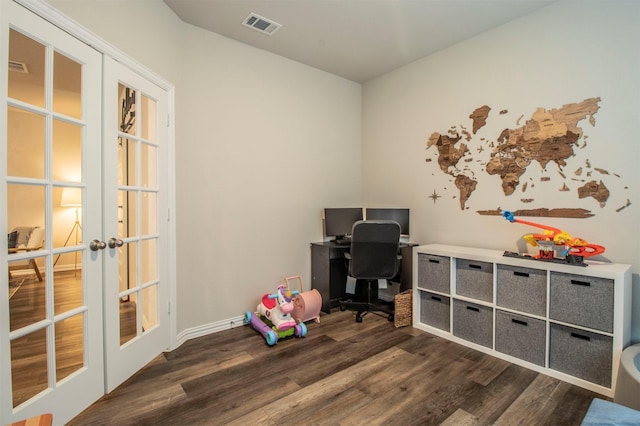 office with french doors, dark wood finished floors, and visible vents