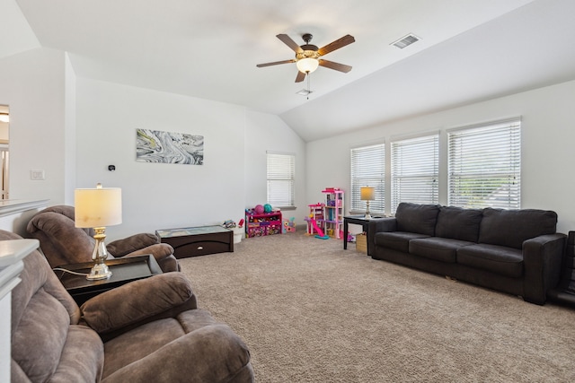 carpeted living area with vaulted ceiling, ceiling fan, and visible vents