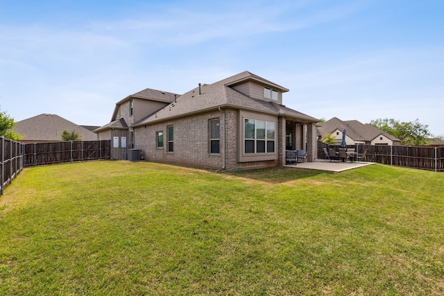 back of house with a patio, a fenced backyard, central air condition unit, brick siding, and a lawn