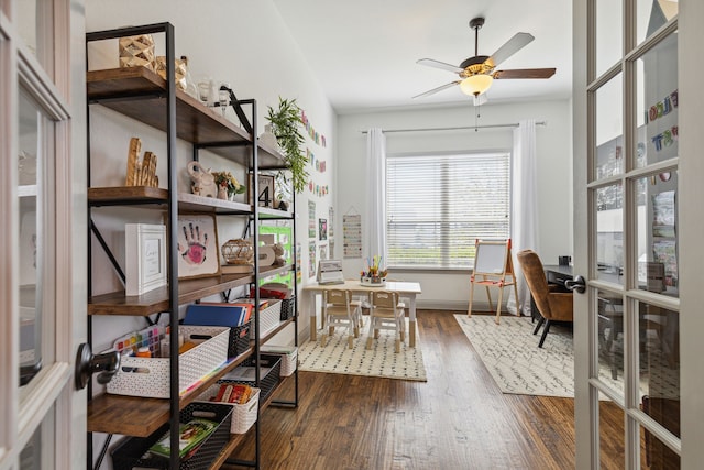 interior space featuring french doors, dark wood finished floors, baseboards, and ceiling fan