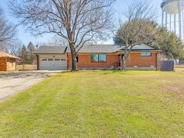 ranch-style home with crawl space, brick siding, fence, and driveway