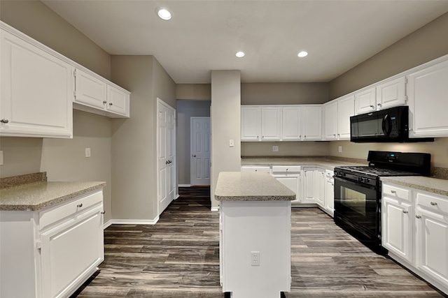 kitchen featuring black appliances, a kitchen island, dark wood-style floors, and recessed lighting