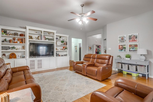 living area featuring ceiling fan and light wood-style flooring