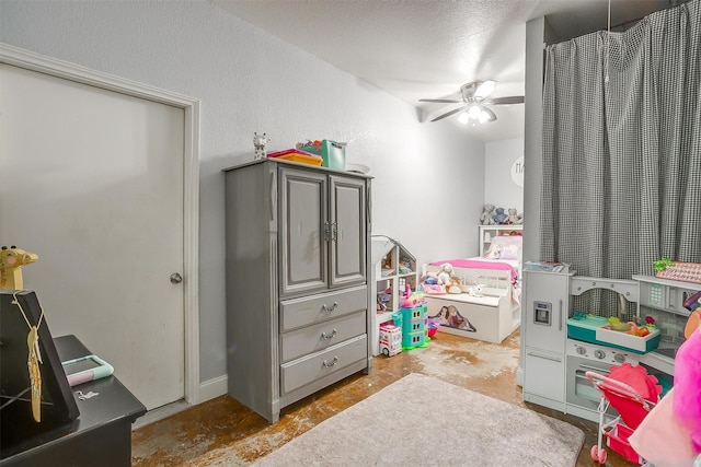 bedroom with concrete flooring, ceiling fan, and a textured ceiling