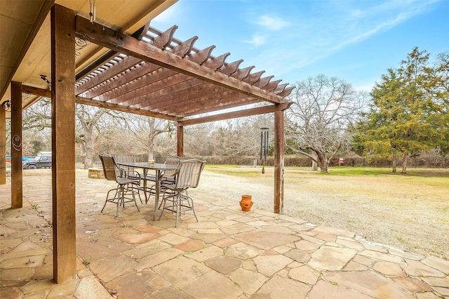 view of patio with outdoor dining space and a pergola