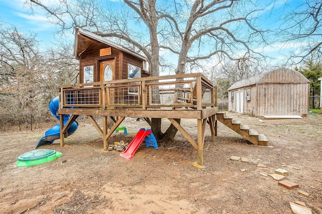 view of jungle gym with an outbuilding and a shed