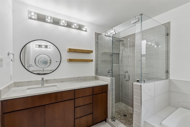 full bath featuring a stall shower, a garden tub, and vanity