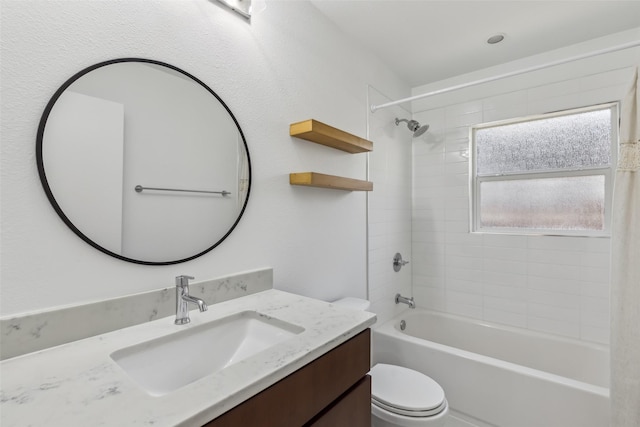 full bathroom featuring toilet, shower / washtub combination, and vanity