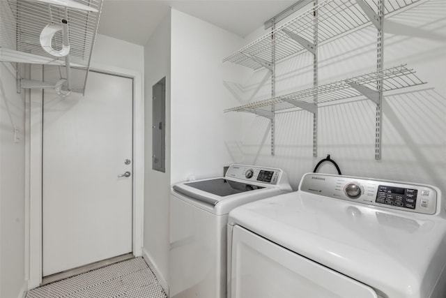 laundry area featuring laundry area, electric panel, and independent washer and dryer