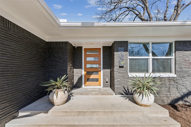 entrance to property with brick siding