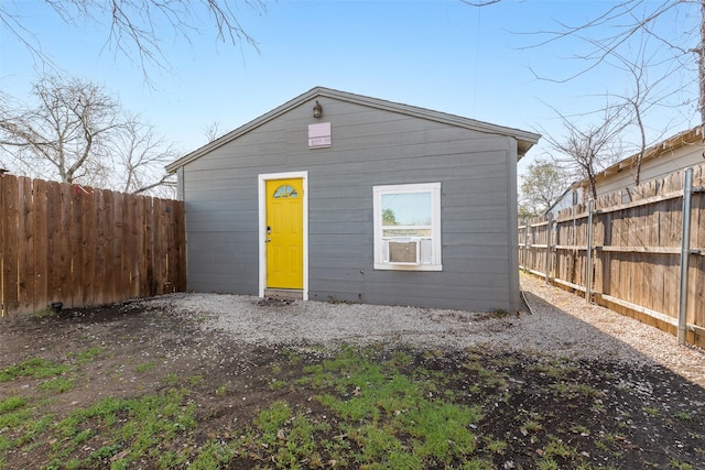 exterior space featuring an outdoor structure and a fenced backyard