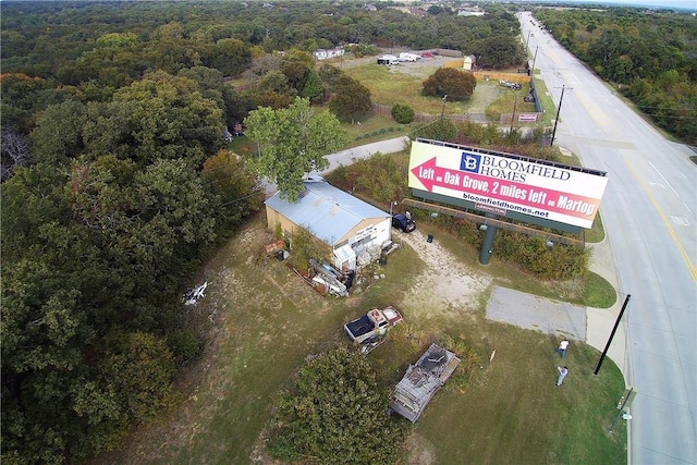 aerial view featuring a wooded view