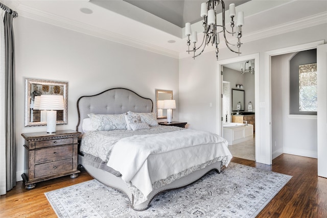 bedroom featuring baseboards, a notable chandelier, ornamental molding, and wood finished floors