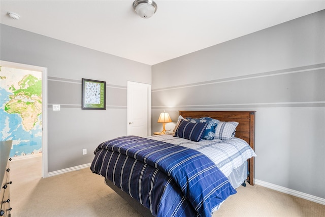 carpeted bedroom with baseboards