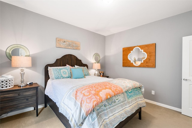 bedroom featuring carpet floors and baseboards