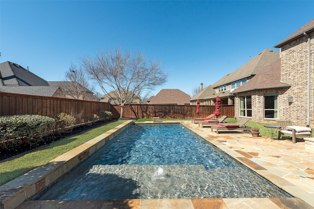 view of swimming pool featuring a patio, a fenced backyard, and a fenced in pool