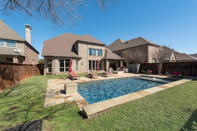 view of swimming pool featuring a fire pit, a fenced in pool, a patio, a fenced backyard, and a yard