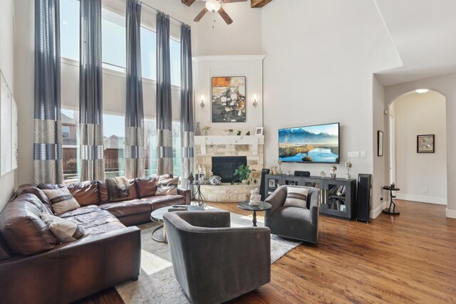 kitchen featuring glass insert cabinets, visible vents, appliances with stainless steel finishes, and arched walkways