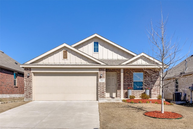 craftsman inspired home featuring an attached garage, brick siding, driveway, roof with shingles, and board and batten siding