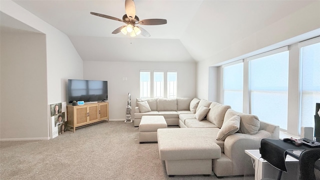 living room with lofted ceiling, ceiling fan, light carpet, and baseboards