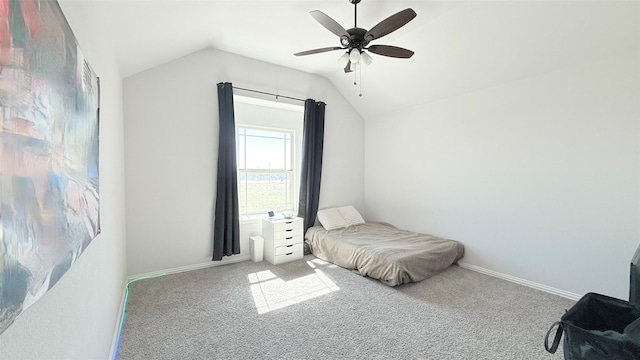 bedroom with vaulted ceiling, ceiling fan, carpet flooring, and baseboards