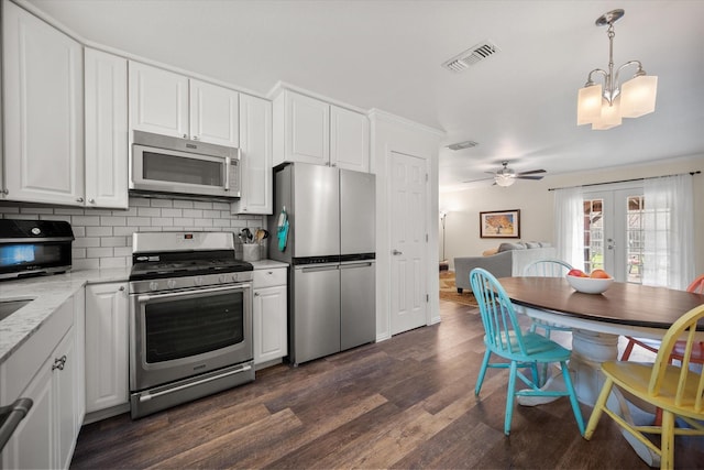 kitchen featuring french doors, tasteful backsplash, visible vents, appliances with stainless steel finishes, and white cabinets