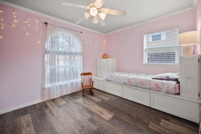 bedroom featuring ceiling fan, multiple windows, wood finished floors, and crown molding