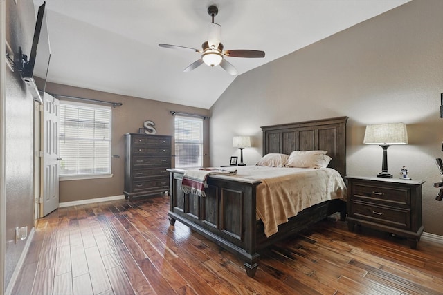 bedroom with lofted ceiling, ceiling fan, baseboards, and dark wood finished floors