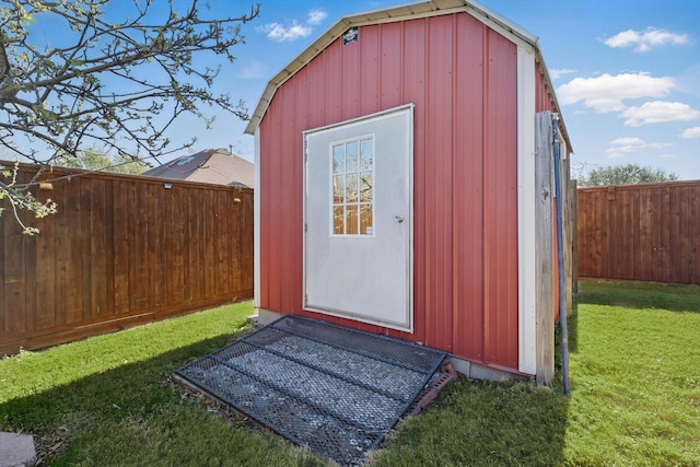 view of shed featuring a fenced backyard