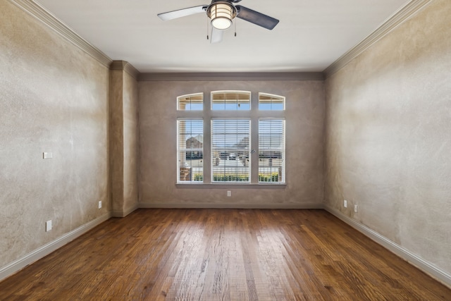 unfurnished room with ornamental molding, wood-type flooring, a ceiling fan, and baseboards