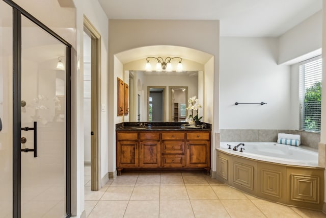 5805 Parker Village Dr, Parker, TX 75002 - full bath with a garden tub, a shower stall, tile patterned floors, vanity, and a chandelier