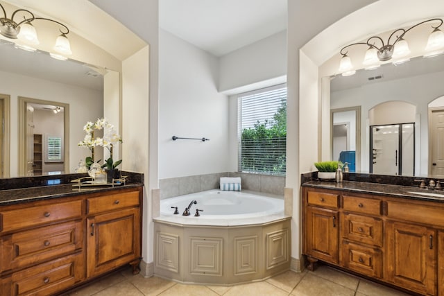 5805 Parker Village Dr, Parker, TX 75002 - full bathroom featuring tile patterned floors, a bath, two vanities, and a stall shower