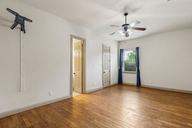5805 Parker Village Dr, Parker, TX 75002 - unfurnished bedroom featuring wood finished floors, baseboards, ceiling fan, and connected bathroom