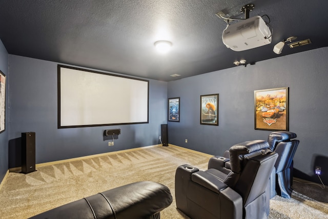 carpeted home theater room featuring baseboards and a textured ceiling