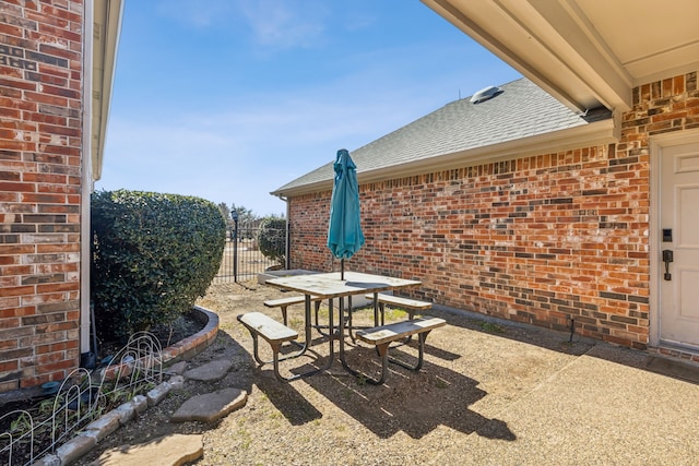 view of patio / terrace with outdoor dining space and fence