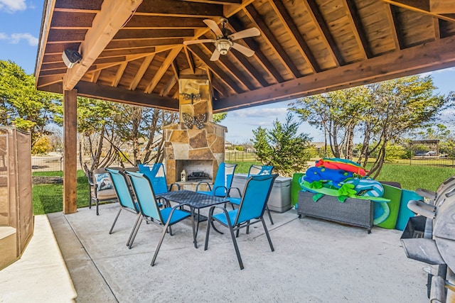 5805 Parker Village Dr, Parker, TX 75002 - view of patio with an outdoor stone fireplace, fence, a gazebo, and a ceiling fan