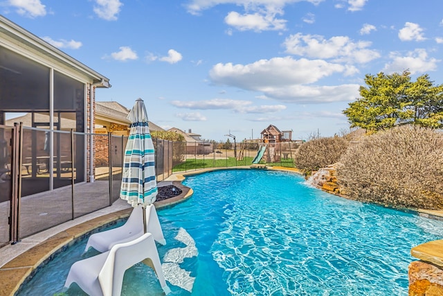 5805 Parker Village Dr, Parker, TX 75002 - view of swimming pool featuring a playground, a fenced backyard, and a sunroom