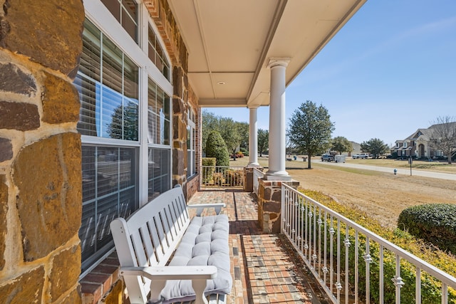 balcony featuring a porch