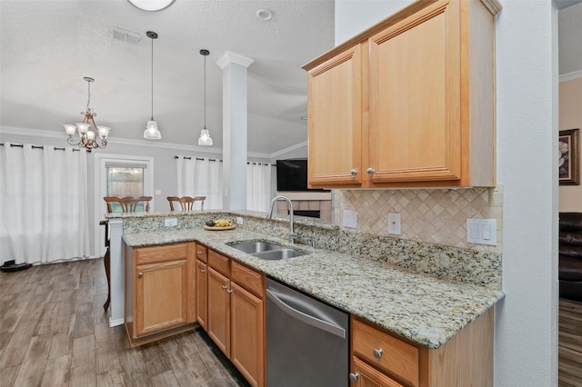 kitchen with crown molding, visible vents, a sink, and dishwasher