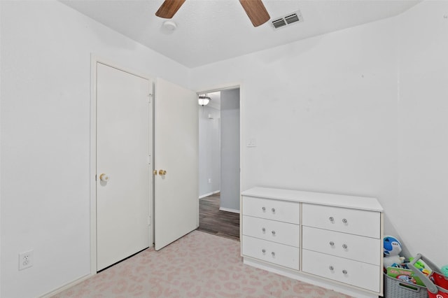 unfurnished bedroom with visible vents and ceiling fan