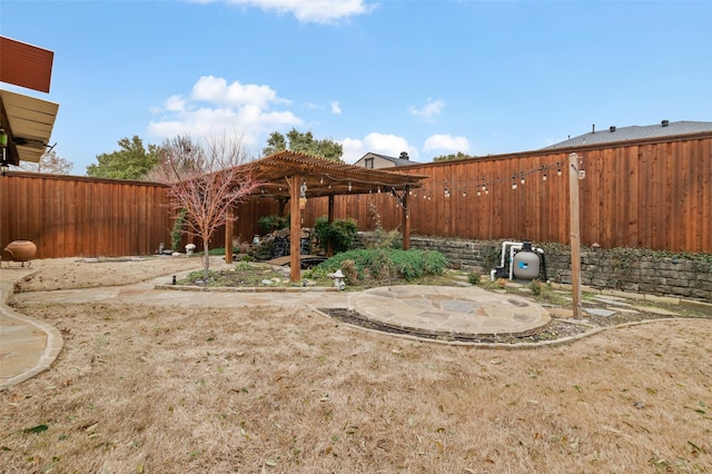 view of yard featuring a patio area, a fenced backyard, and a pergola