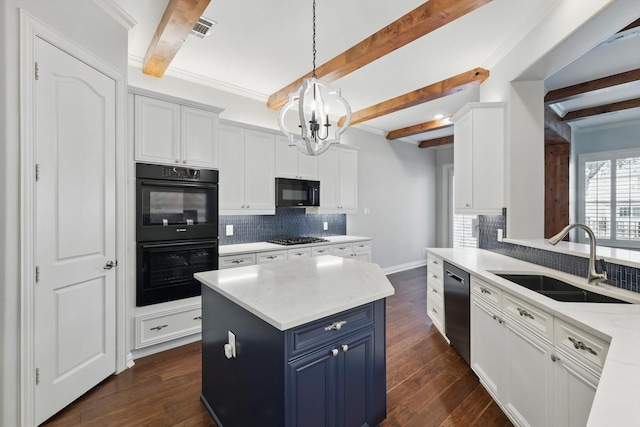 kitchen with dark wood-type flooring, blue cabinets, light countertops, black appliances, and a sink