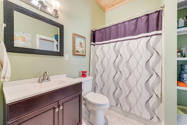 full bath with vanity, a shower with shower curtain, and toilet